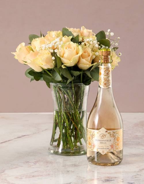 Graceful Peach Roses in Glass Vase