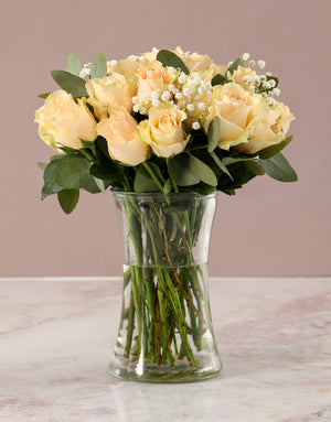Graceful Peach Roses in Glass Vase