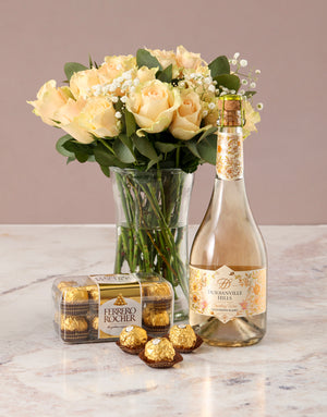 Graceful Peach Roses in Glass Vase